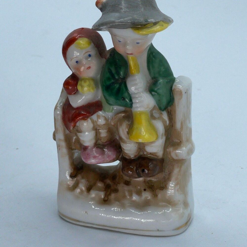 Vintage Occupied Japan figurine boy playing flute on bench w/girl